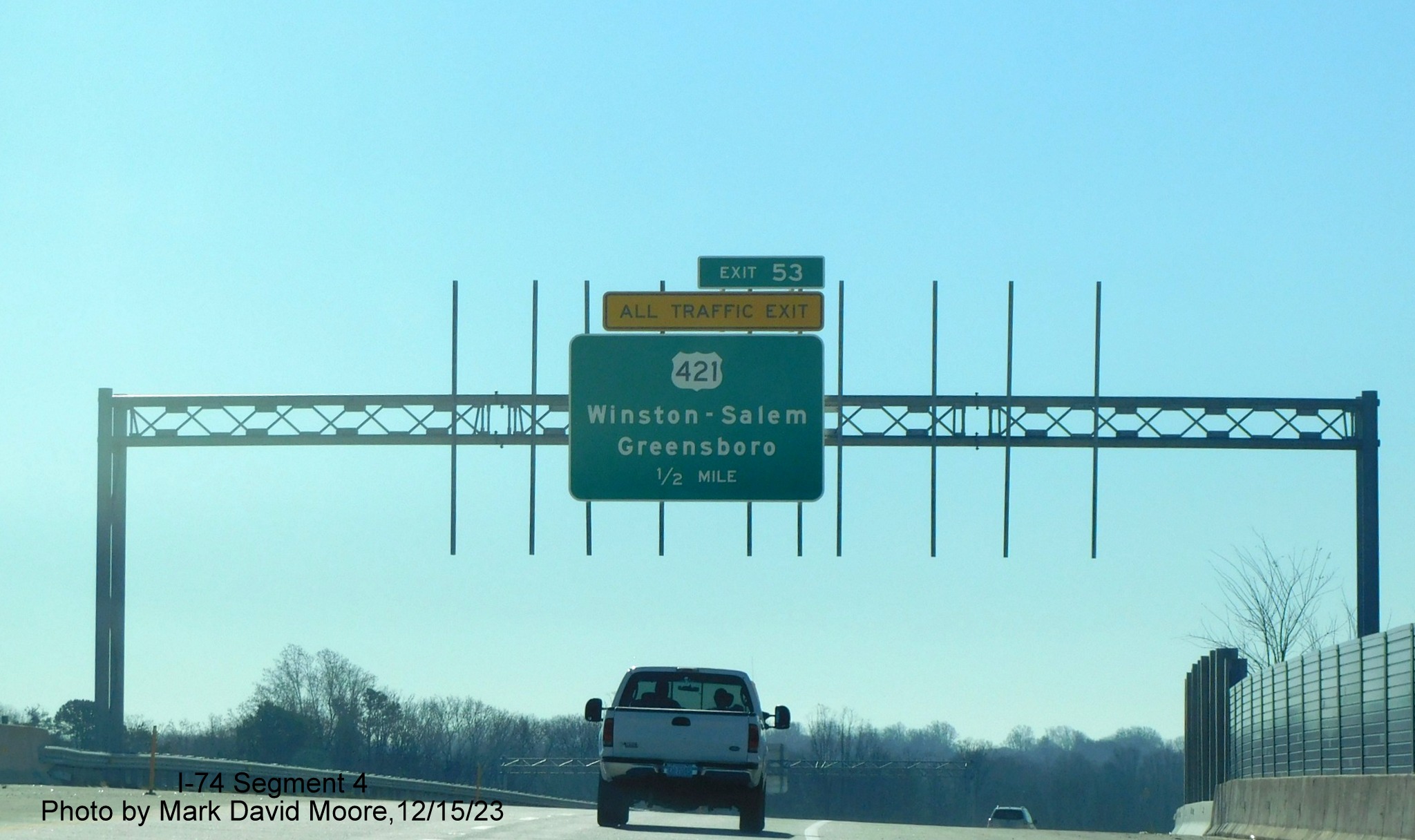 Image of 1/2 Mile advance overhead sign for US 421 exit on NC 74 (Future I-74) East/
        Winston-Salem Northern Beltway, by Mark David Moore, December 2023