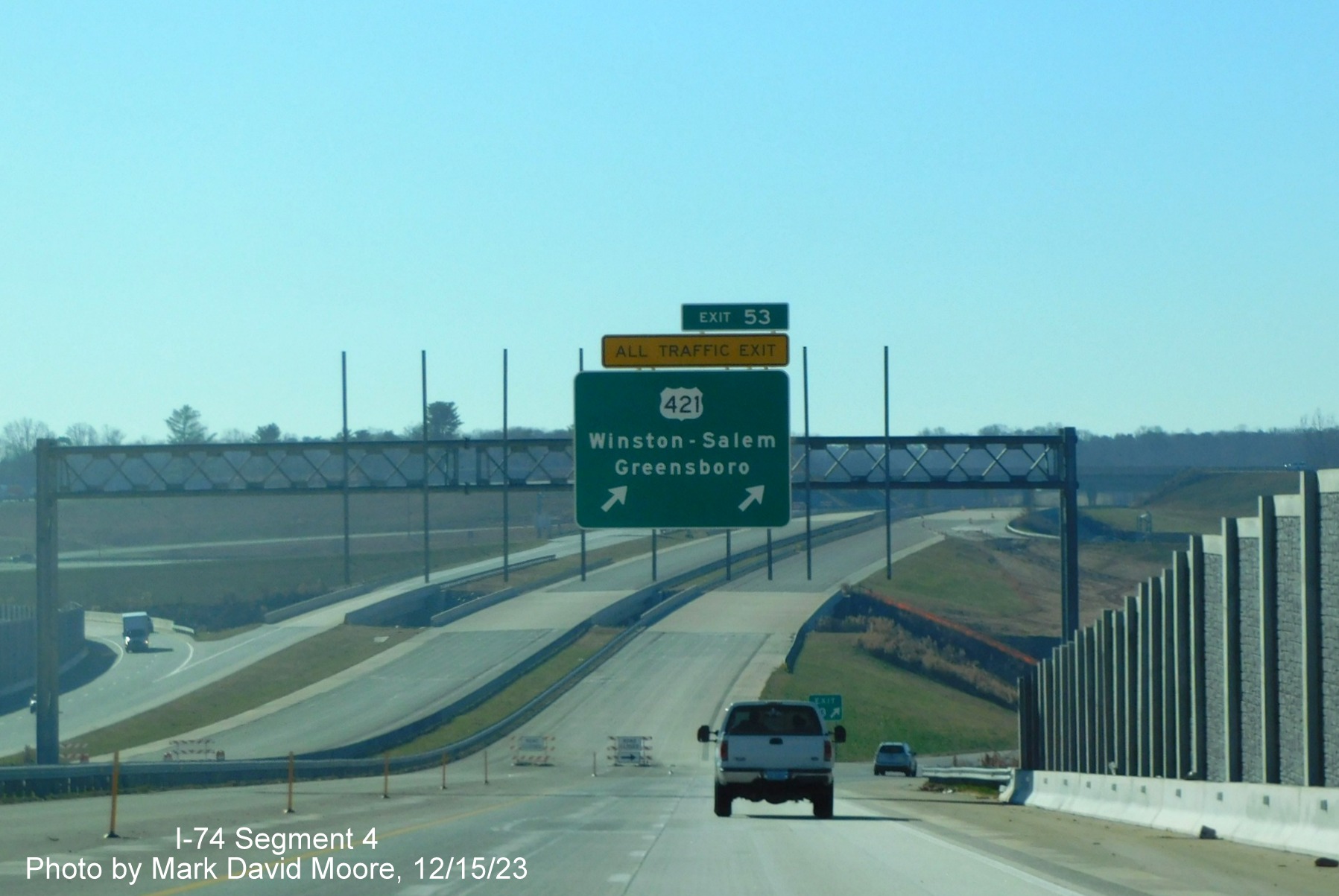Image of overhead ramp sign for US 421 C/D ramp at current end of NC 74 (Future I-74) East/
        Winston-Salem Northern Beltway, by Mark David Moore, December 2023