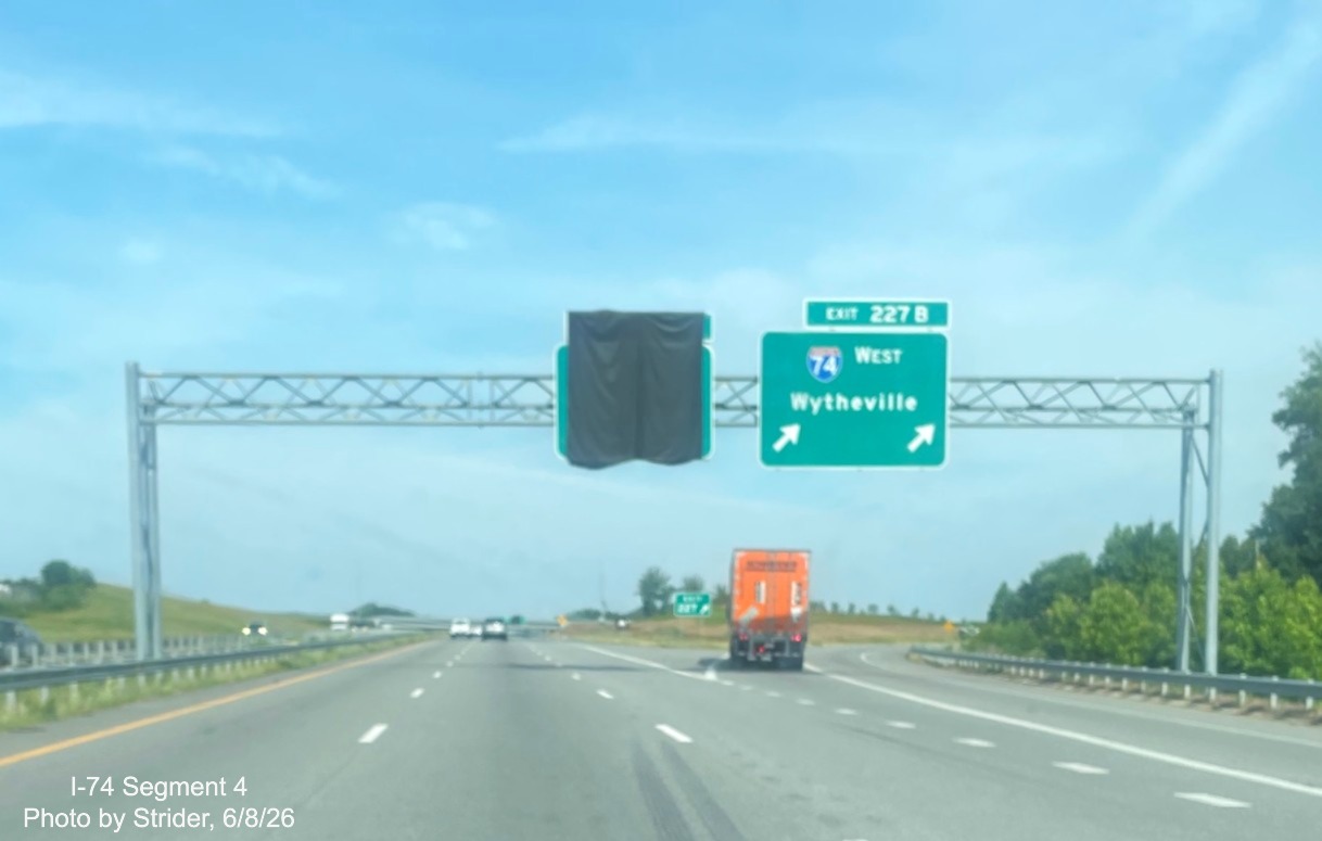 Image of new I-74 West overhead ramp sign and covered over 1/2 mile advance for the
	  future eastbound ramp at the Beltway interchange on US 421 North, photo by Strider, June 2026