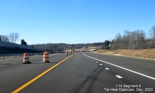 Image of newly opened lane of NC 74 (Future I-74) West after the NC 66 bridge heading towards
        US 52, from video by Tar Heel Dashcam, December 2023