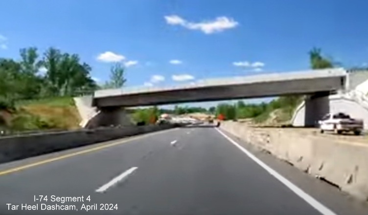 Image of driving under the Ziglar Road bridge on US 52 North prior to the future ramp to NC 74 Winston-Salem 
        Northern Beltway, screen grab from Tar Heel Dashcam video, April 2024