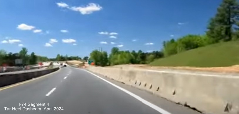 Image of driving US 52 North by the future ramp to NC 74 Winston-Salem 
        Northern Beltway still under constructions, screen grab from Tar Heel Dashcam video, April 2024