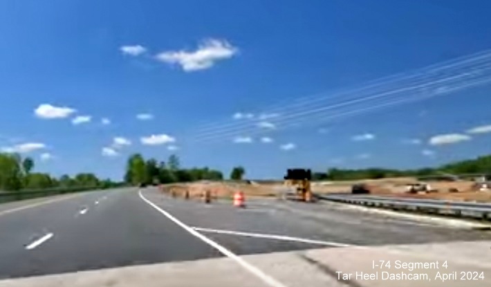 Image of closeup of future ramp to I-274 West/Winston-Salem Northern Beltway showing current work, 
        screen grab from Tar Heel Dashcam video, April 2024