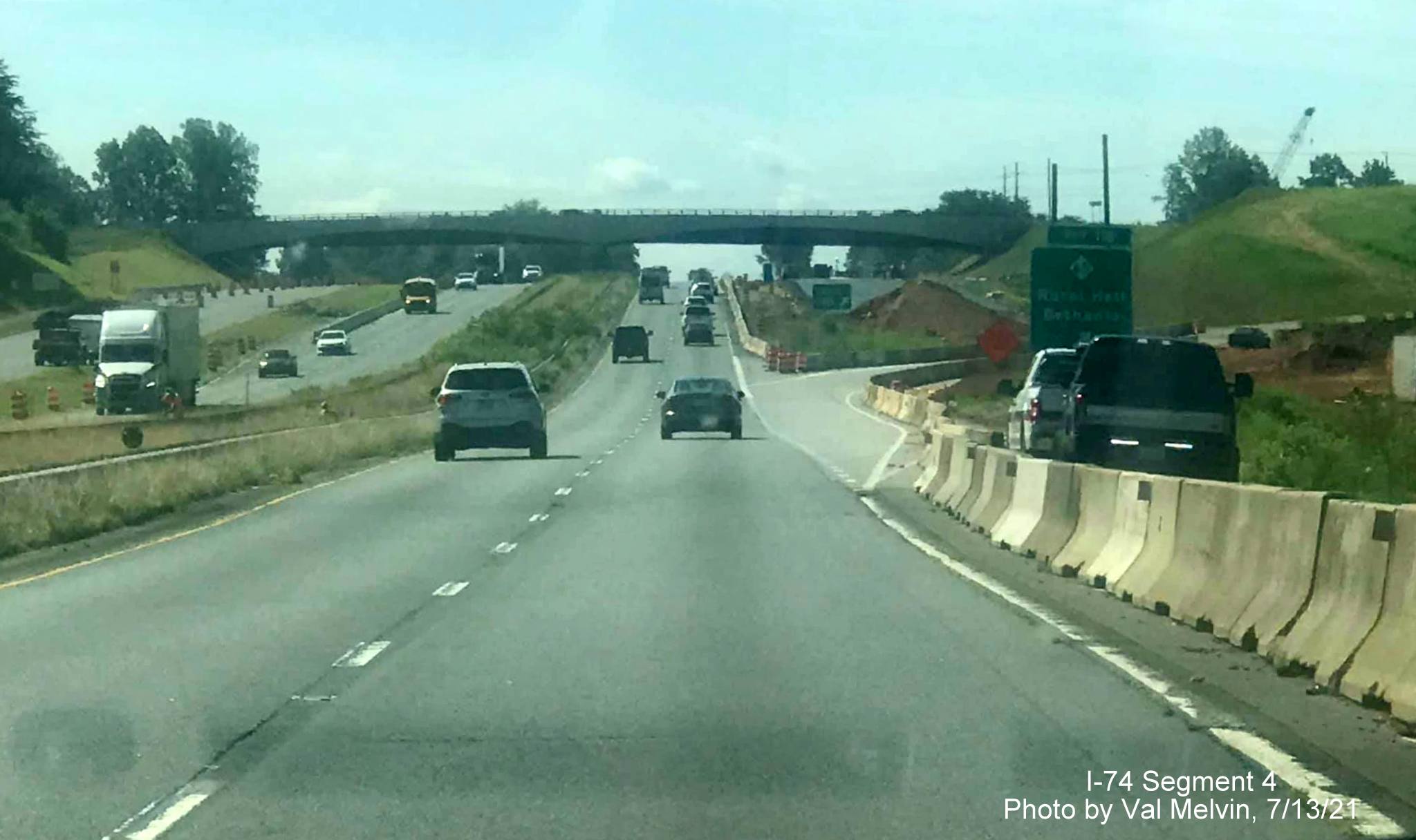 Image of Winston Salem Northern Beltway 
        interchange construction at NC 65 exit in Rural Hall on US 52 South (Future I-74 East), by Val Melvin. July 2021