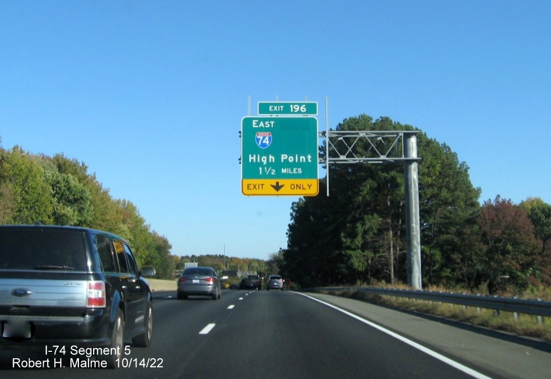 Image of 1 1/2 miles advance overhead sign for I-74 East exit on I-40 East in Winston-Salem with 
        dropped South US 311 information, October 2022