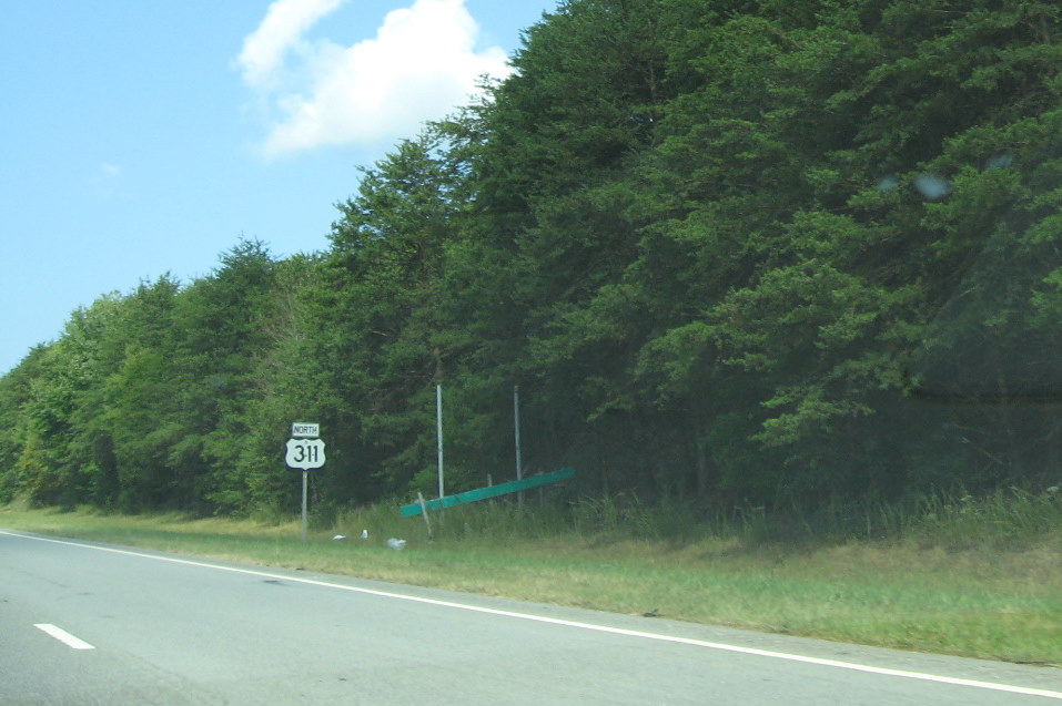 Photo of remaining sign posts for possible new exit sign at the end of the US 311/Future I-74 freeway, Sep. 2009