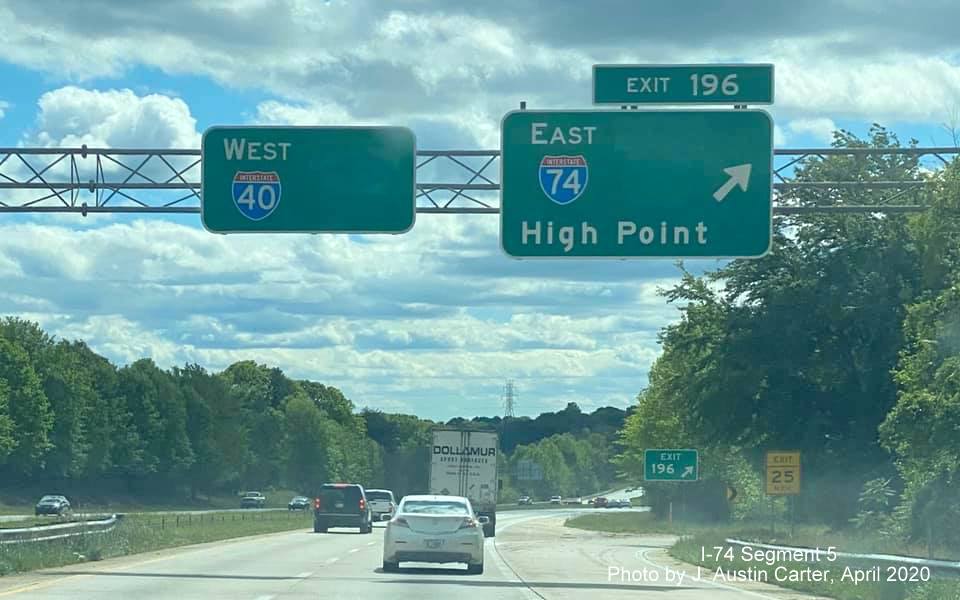 Image of overhead signs on I-40 West at I-74 in Winston-Salem with US 311 shields removed, by J. Austin 
                                         Carter in April 2020