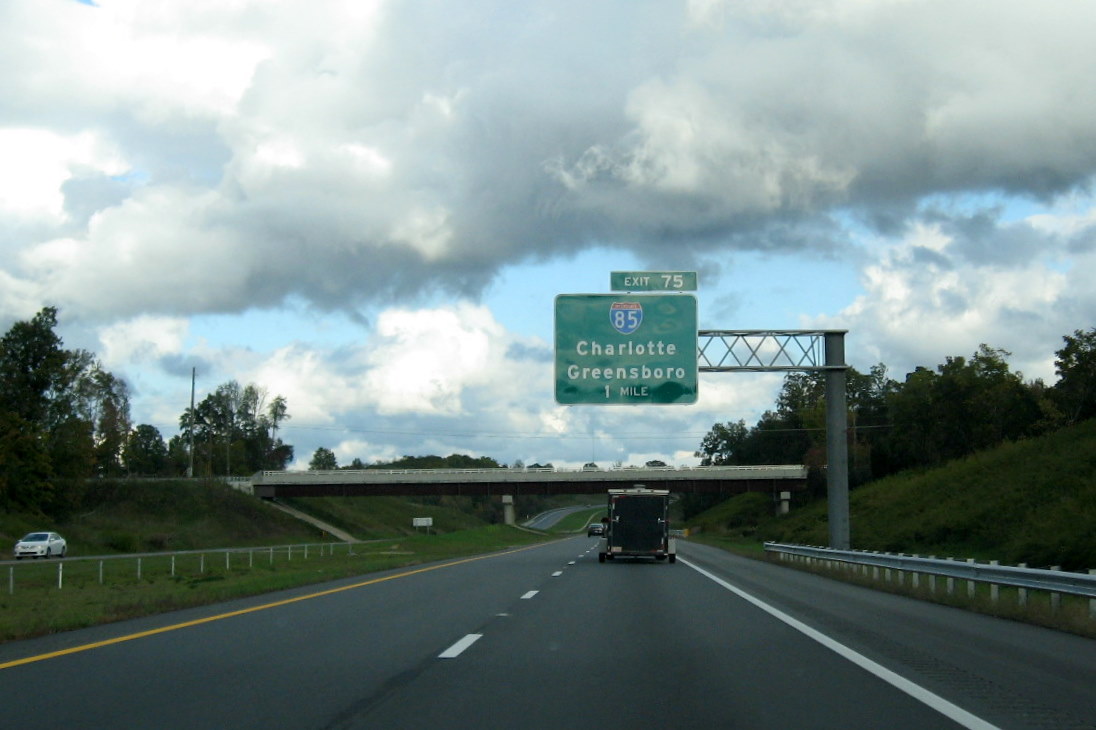 Photo of approaching Jackson Lake Rd Bridge on I-74 East and I-85 
exit sign, Oct. 2011