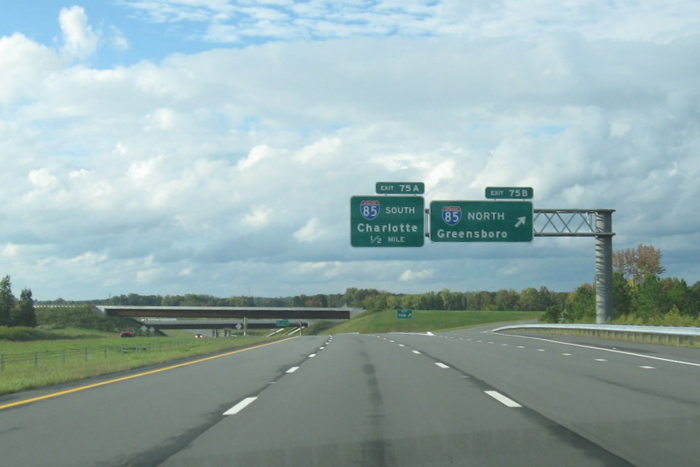 Photo of I-85 exit signage on I-74 West near interchange bridges and ramps, 
Oct. 2011