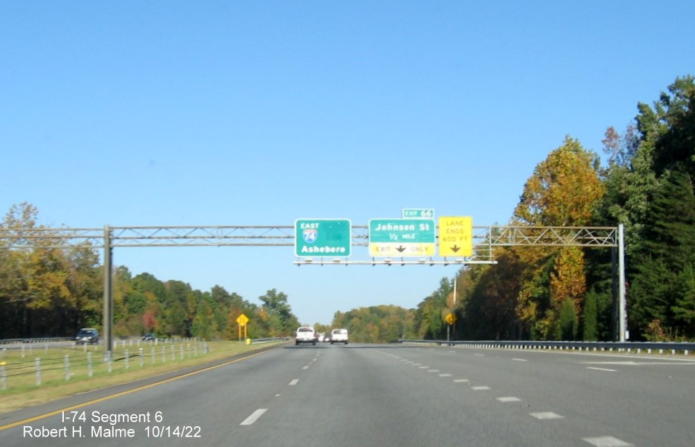 Image of East I-74 pull through sign with blank space from removed South US 311 information on I-74 
        East in High Point, October 2022