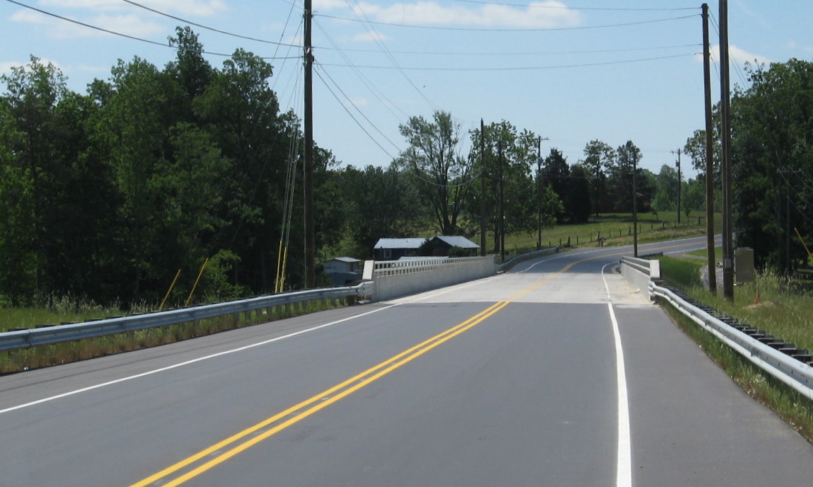 Photo of Jackson Lake Rd Bridge after receiving its final coat of asphalt 
in April 2010