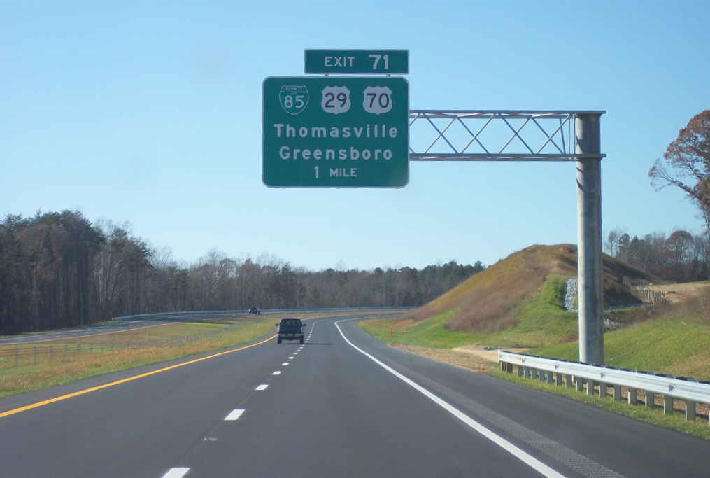 Photo of sign for Business 85 exit off of I-74 west near the Jackson Lake 
Rd Bridge, Nov. 2010 Courtesy of Adam Prince