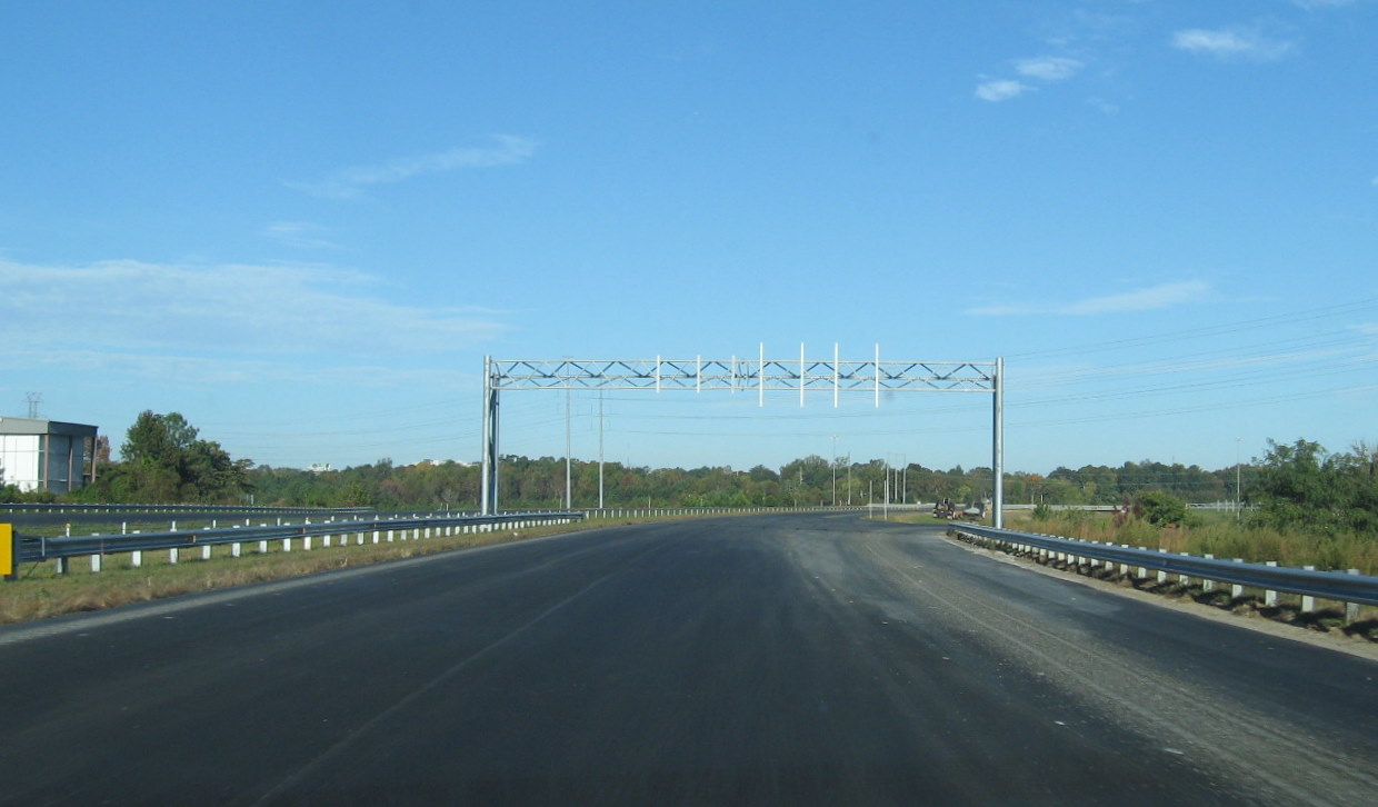 Photo of new exit sign gantries put up on Business 85 but still 
awaiting signs in Oct. 2010