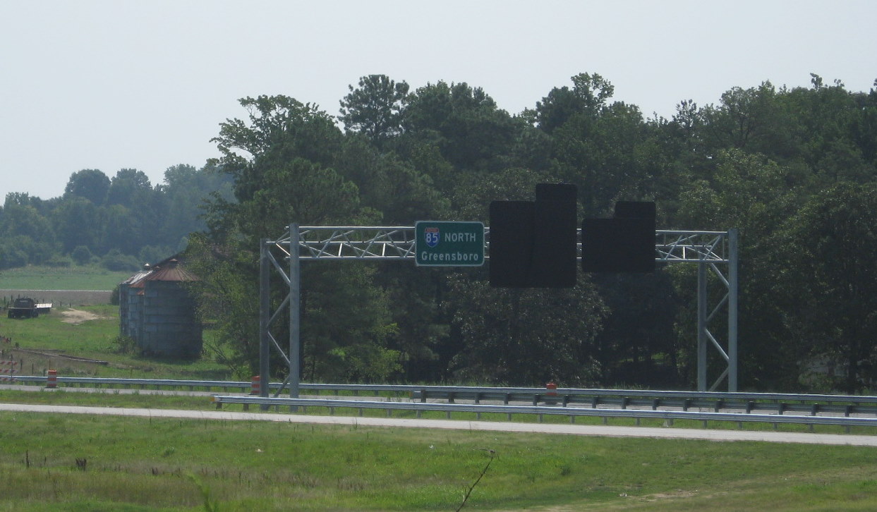 Photo of new sign assembly for I-74 West approaching the interchange on 
I-85 North in July 2010