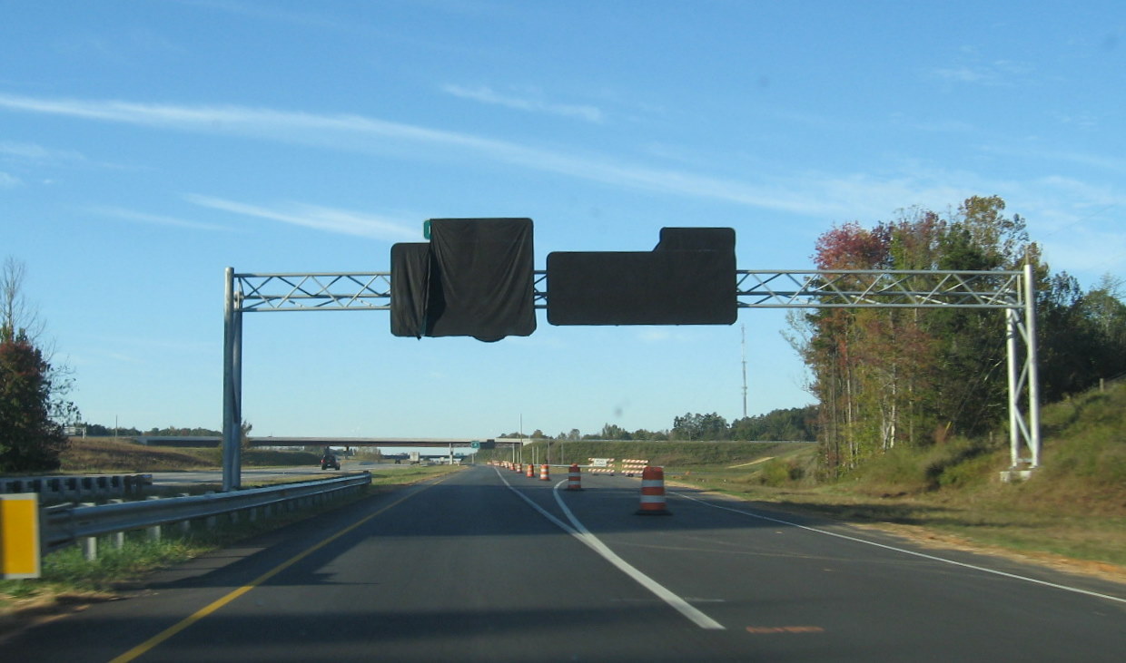 Photo of covered I-74 East and West exit signs from I-85 North, Oct. 
2010