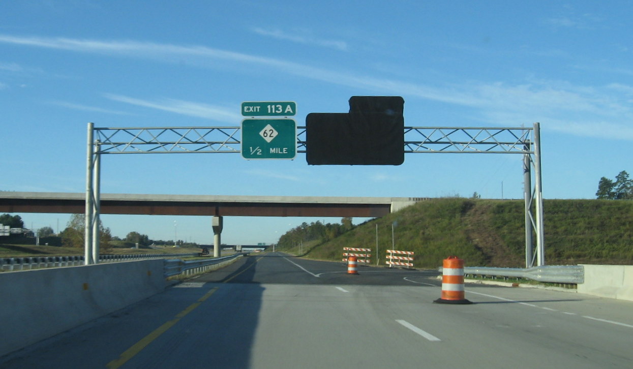 Photo of covered sign for future I-74 East exit from I-85 in Oct. 2010