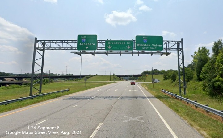 Overhead signage at Business 85 South interchange with I-74 with blank space for former US 311 
        signs, Google Maps Street View image, August 2021