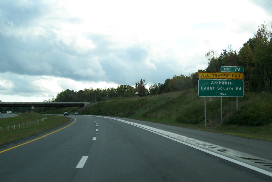 Photo of first exit sign on new portion of I-74 East freeway for the Cedar 
Square Road interchange near Glenola in October 2011