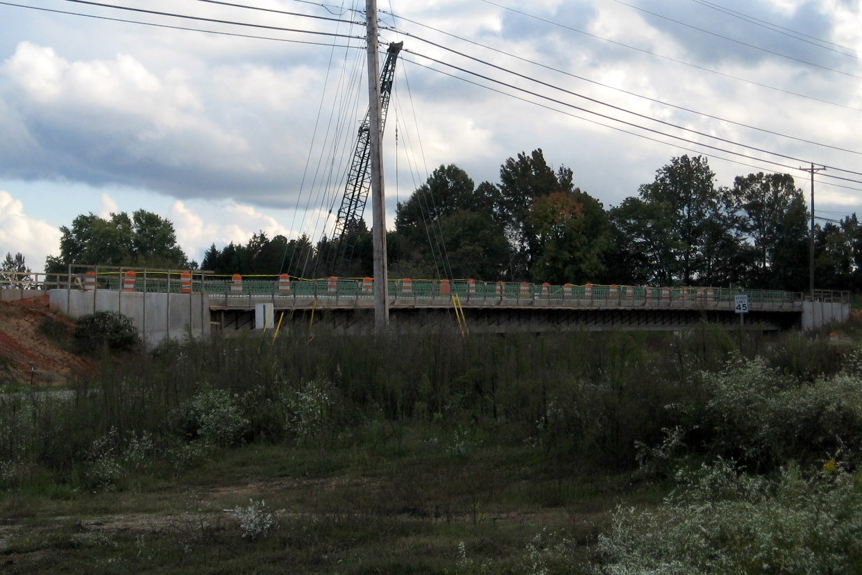 Photo showing progress in completing the Branson Davis Rd bridge over the 
future I-74 freeway in Oct. 2011