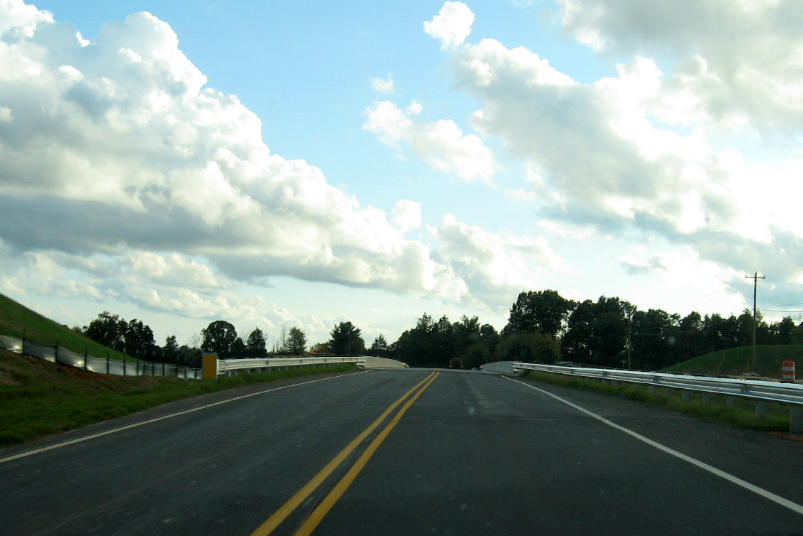 Photo showing driving over the completed Plainfield Rd Bridge over the future 
I-74 freeway near Randleman in Oct. 2011