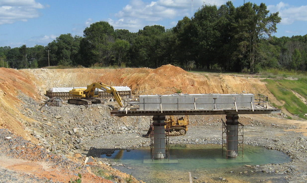 Photo showing completed center support for Plainfield Rd Bridge over the 
future I-74 freeway in Oct. 2010