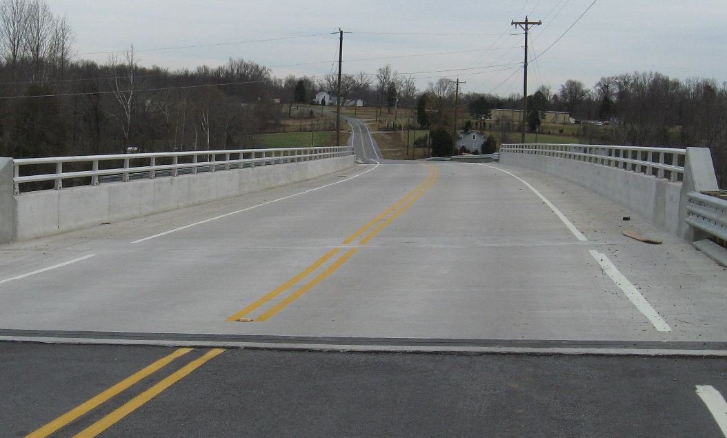 Photo of opened Tuttle Road Bridge in Dec. 2009 showing need for more
pavement to smooth transition from road to bridge