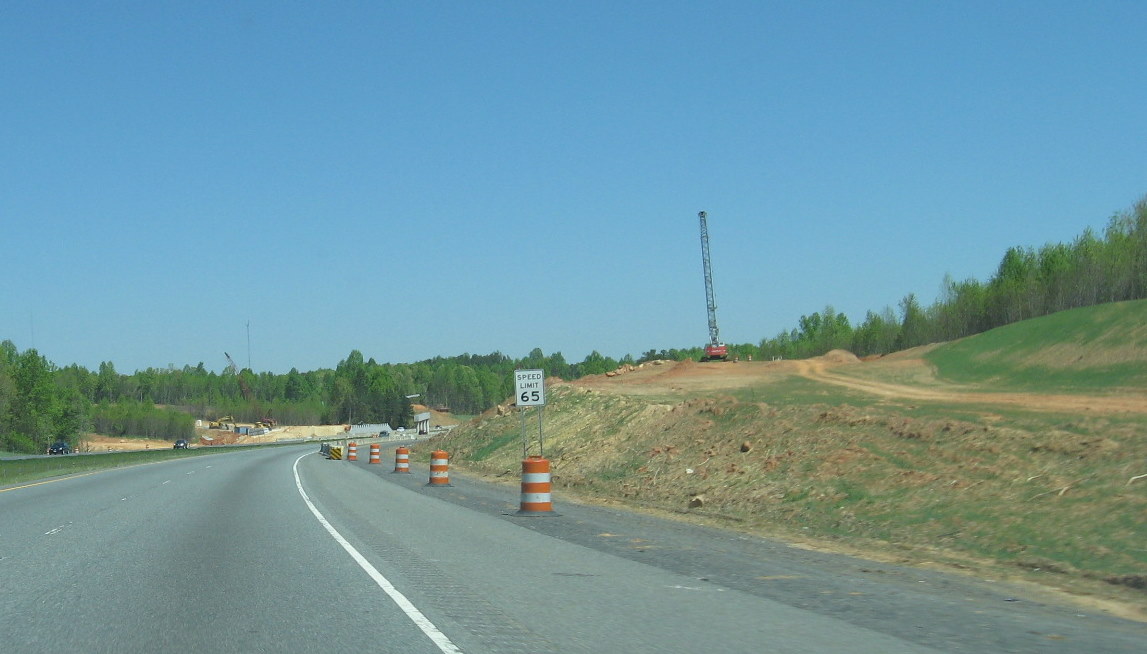 Photo of progress building future I-74 ramp bridges supports from US 220 
South in Randleman, Apr. 2010