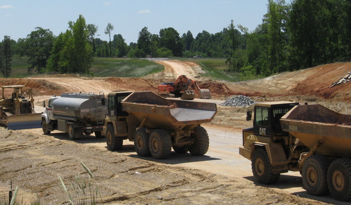 Photo of the many construction vehicles involved in building the Cedar 
Square Rd interchange with I-74 in May 2010