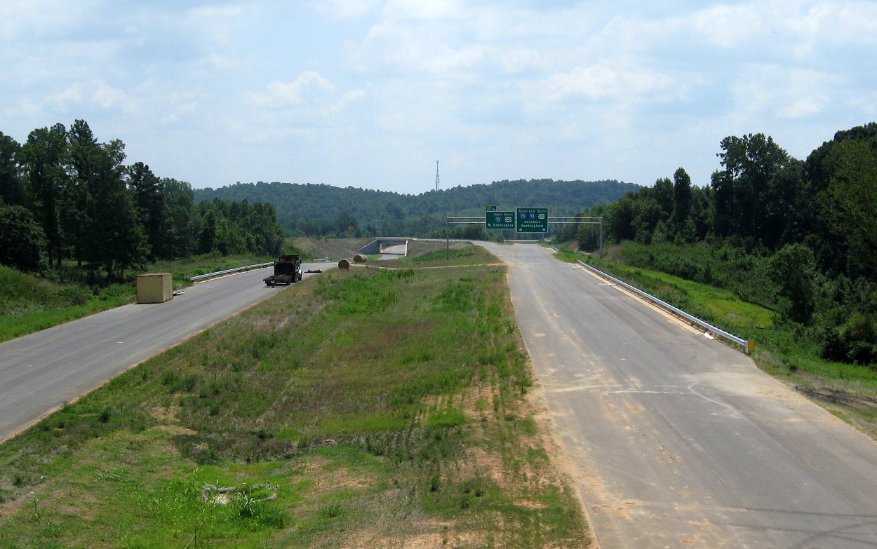 Photo of view south of Heath Dairy Road Bridge showing overhead signs now in 
place for US 220 interchange on future I-74 freeway near Randleman, Aug. 2012