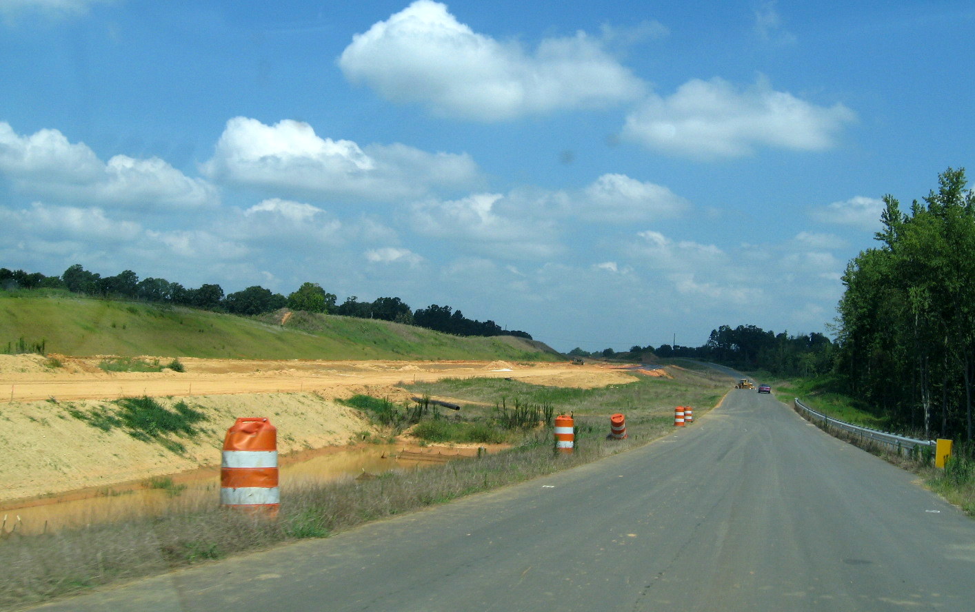 Photo of new alignment for Branson Davis Rd along completed bridge over future 
I-74 freeway in Aug. 2012