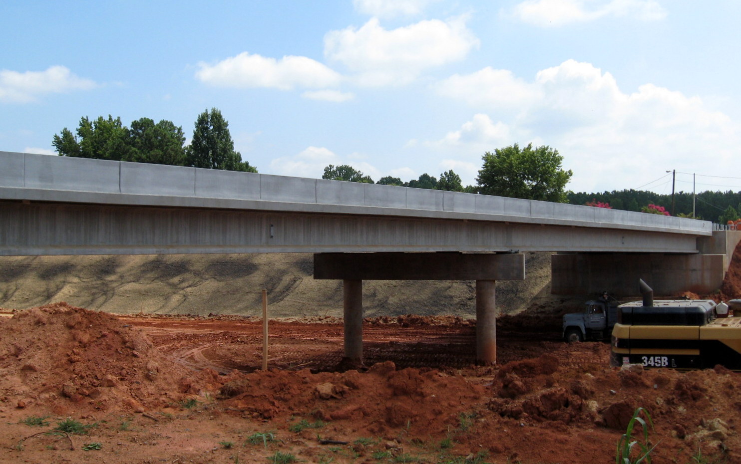 Photo showing progress in removing soil from under completed Walker Mill Rd 
Bridge for future I-74 freeway in Aug. 2012