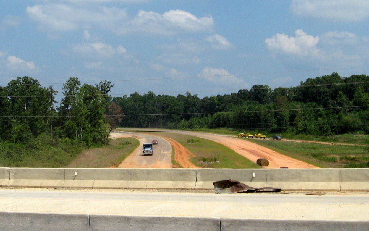 Photo of progress constructing roadbed near US 311 bridge over future I-74 
freeway in Sophia, Aug. 2012