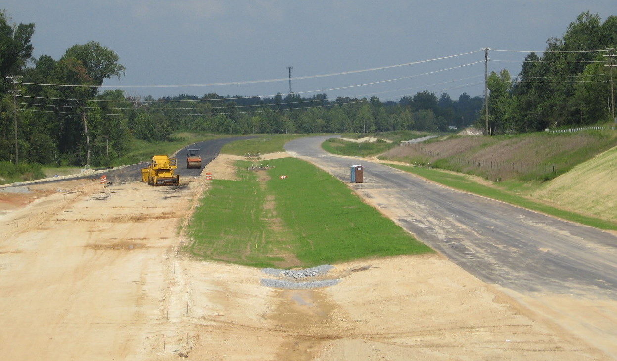 Photo of view from Cedar Square Rd bridge north toward Poole Road showing 
progress on constructing I-74 freeway in Aug. 2010