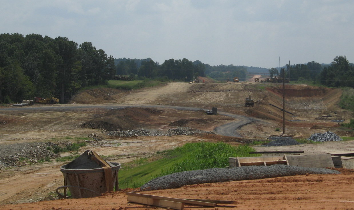 Photo of view south of Plainfield Rd Bridge showing progress in grading the 
future I-74 freeway roadbed in Aug. 2010