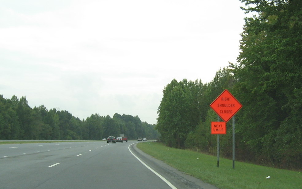 Photo of lane restrictions put up for future I-74 interchange on US 220 
South at start of I-74 interchange construction, Sept. 2009