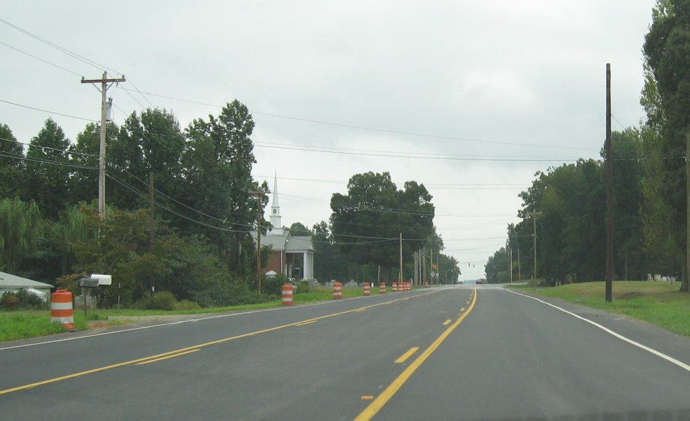 Photo showing the existing US 311 roadway in Sept. 2009 looking south 
toward the traffic light at Spencer Rd