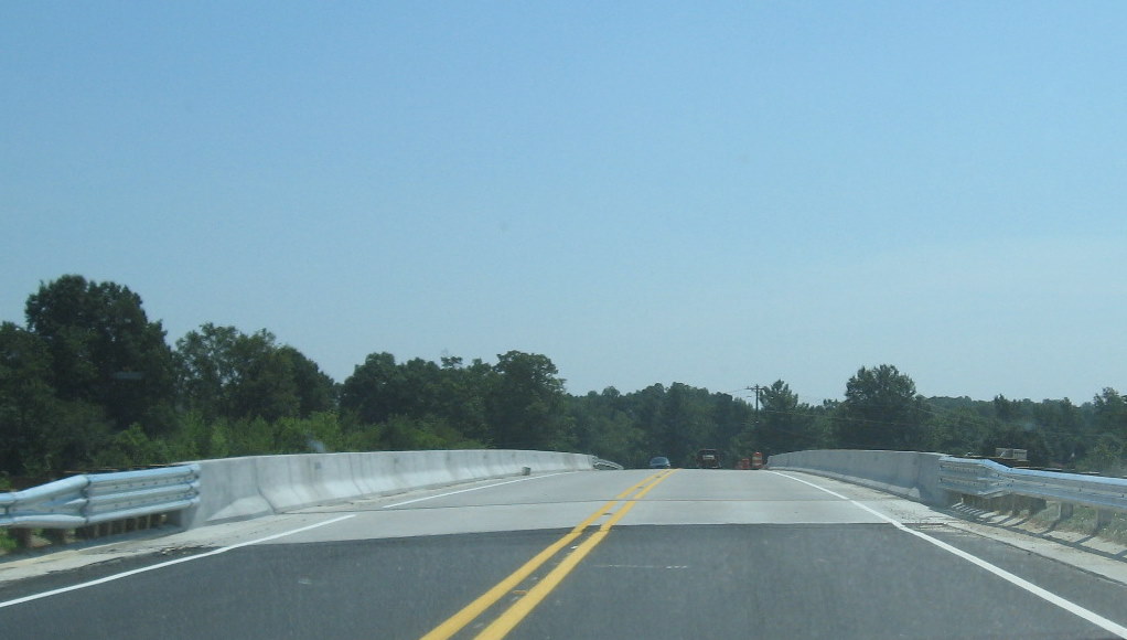 Photo of driving over the opened NC 62 bridge showing work remaining in July 
2009
