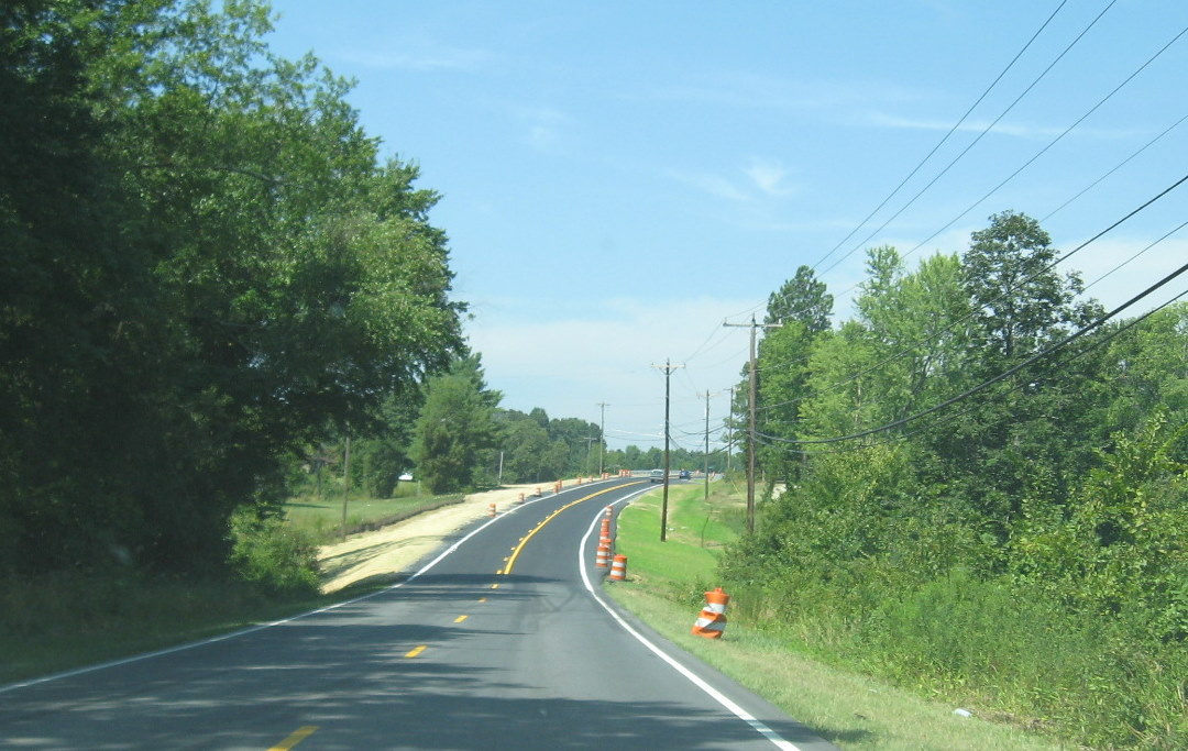 Photo of completed NC 62 bridge over I-74 in July 2009 showing landscaping