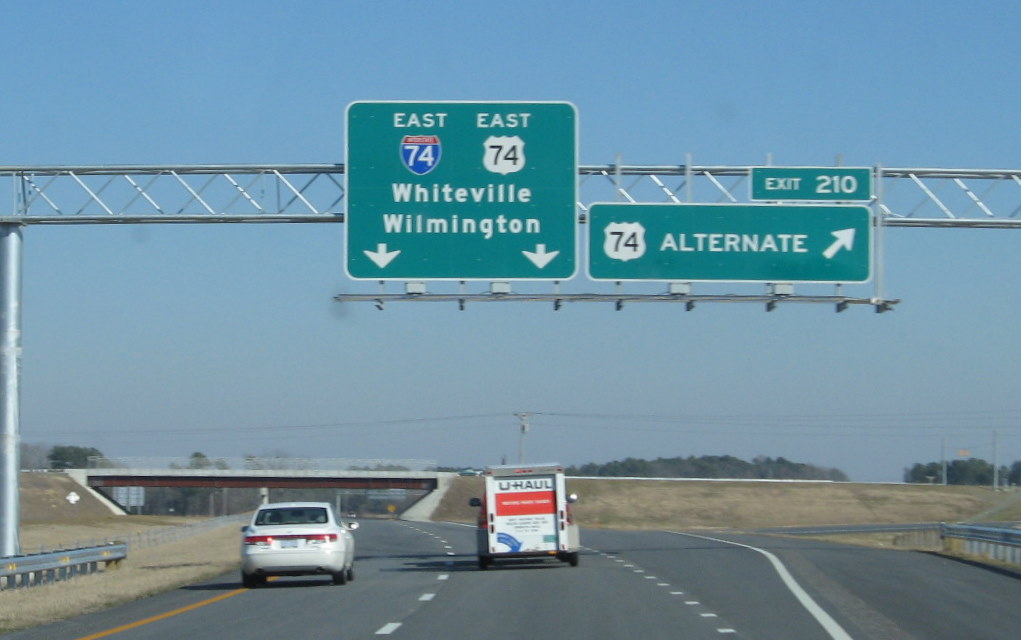 Photo of overhead exit signs installed at end of eastbound I-74 freeway in 
December 2008