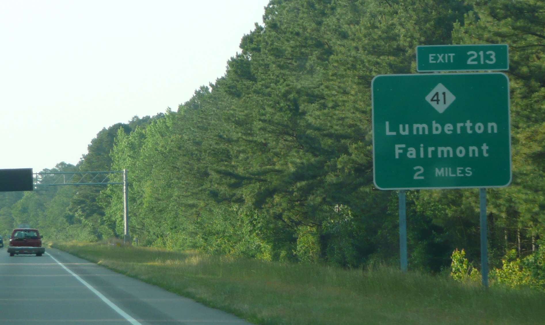 Photo of the first numbered exit sign for I-74 on US 74 West for NC 41, May 
2009