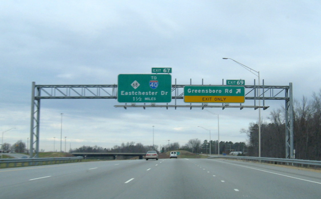 Photo of newly renumbered exit signage along the High Point East Belt freeway 
in Dec. 2008