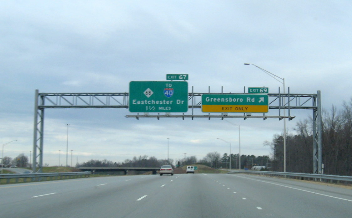 Photo of newly renumbered exit signage along the High Point East Belt freeway 
in Dec. 2008