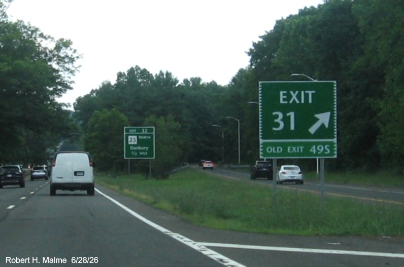 Image of ground mounted ramp sign for the CT 25 South exit, with new milepost based exit 
 number and Old Exit 49S sign on support post on CT 15 North/Merritt Parkway in Bridgeport, by Jay Hogan, October 2025