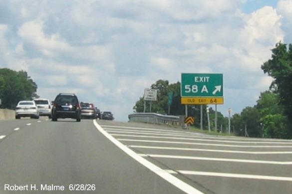 Image of gore sign for the Wallingford exit, with new milepost based exit number overlays 
 on exit tab on CT 15 North/Cross Parkway in Wallingford, June 2026