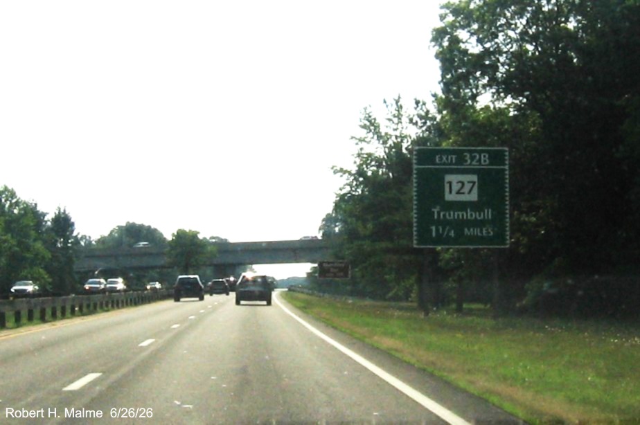 Image of ground mounted 1 1/4 Miles advance sign for the CT 127 exit, with new milepost 
 based exit number on CT 15 South/Merritt Parkway in Trumbull, June 2026