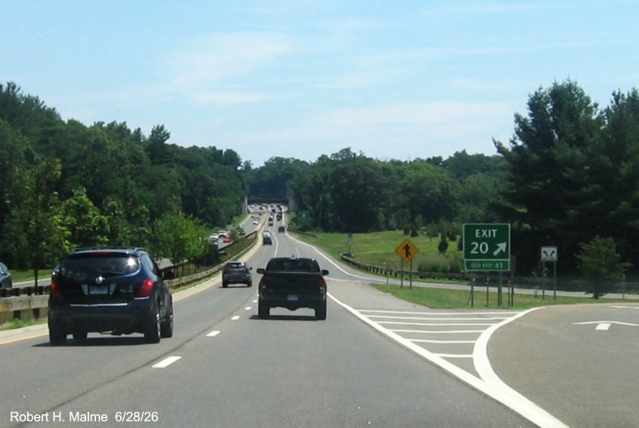 Image of the ground mounted exit sign for the CT 33 exit, with new 
 milepost based exit number on CT 15 North/Merritt Parkway in Westport, June 2026