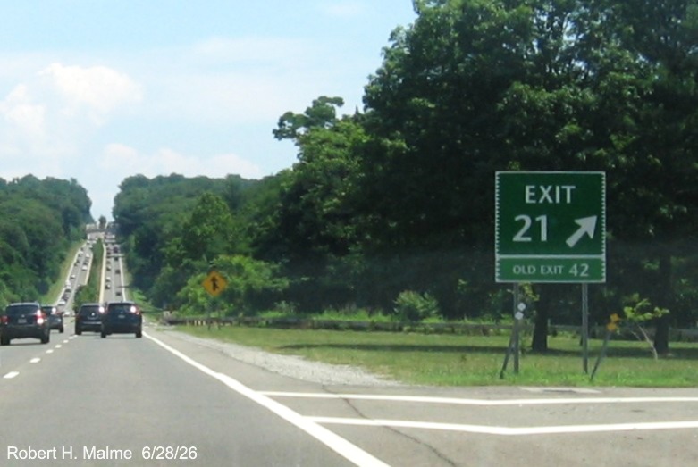 Image of the gore sign for the CT 33 exit, with new milepost based exit number and Old Exit 42
 tab below on CT 15 North/Merritt Parkway in Westport, June 2026