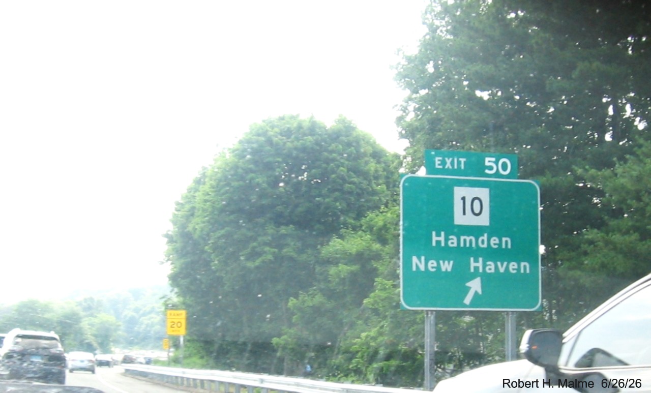 Image of ground mounted ramp sign for the CT 10 exit, with new milepost based exit number on 
 CT 15 South/Cross Parkway in Hamden, June 2026