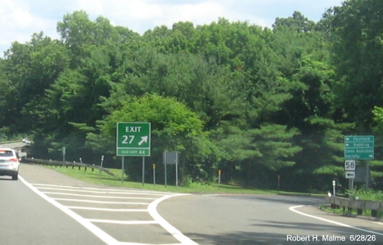 Image of the gore sign for the CT 33 exit, with new milepost based exit number on CT 15 
 North/Merritt Parkway in Fairfield, June 2026