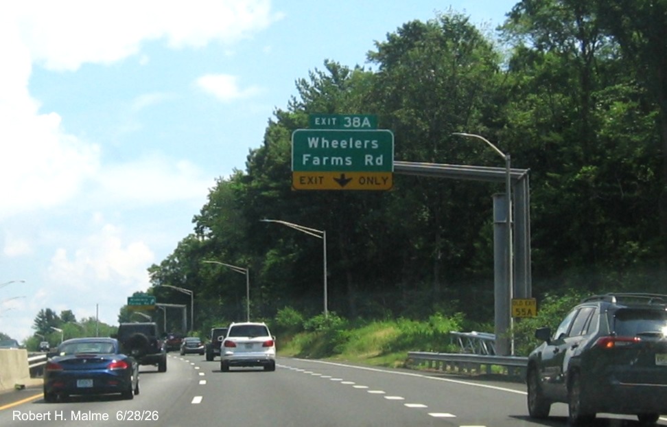 Image of overhead ramp sign for the Wheelers Farm Road exit, with new milepost based 
 exit number on CT 15 North/Cross Parkway in Milford, June 2026